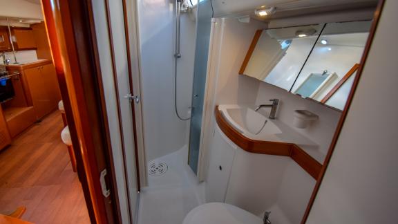 The modern bathroom and shower area of sailing yacht Zezo offer comfort.