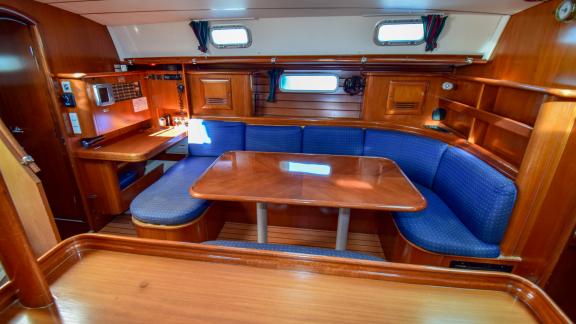 Soft blue sofas and table in the company cabins on Viktoria II