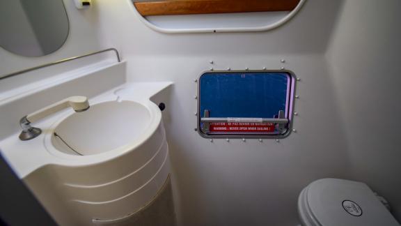 The bathroom on the Andromeda catamaran is compact and functional, keeping everything within reach.