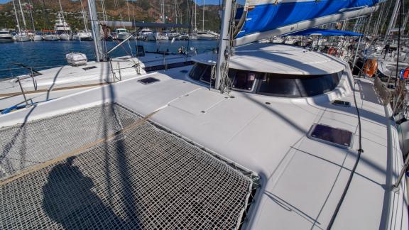 Andromeda catamaran's spacious foredeck area, surrounded by other boats in the marina.