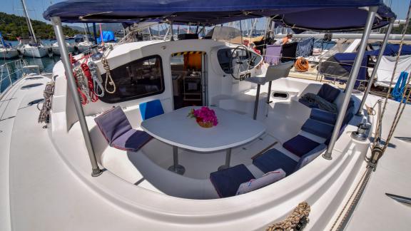 The spacious seating area of the catamaran The Big Easy offers a comfortable spot to enjoy the sea.