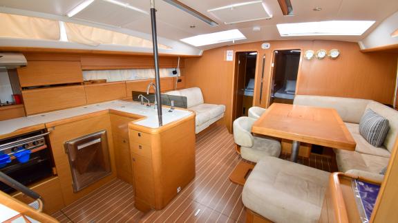 The saloon of the yacht Anja Sophie features a spacious seating and dining area.