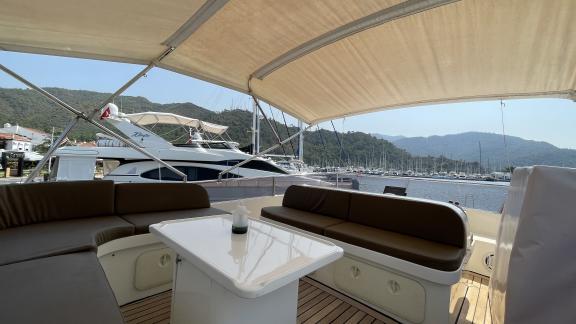 Spacious seating area on the upper deck of motor yacht Sea Shell in Marmaris.