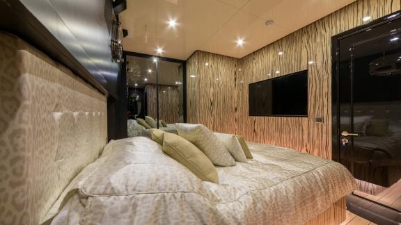 Emanuel's chic beige gulet bedroom. Nice lighting and TV