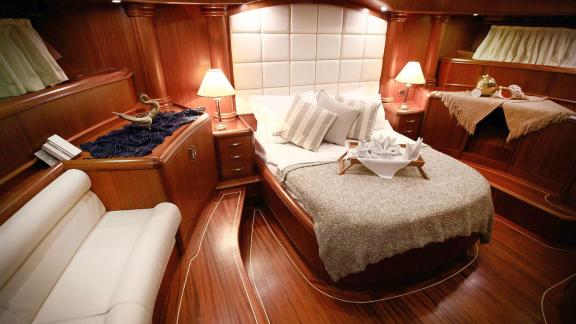 Elegant bedroom of Gulet Nurten A with a comfortable bed and stylish decor.