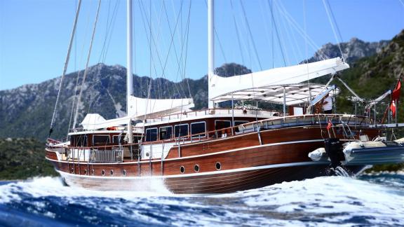 The gulet Nurten A impresses with its wooden hull as it glides smoothly over the blue waters.