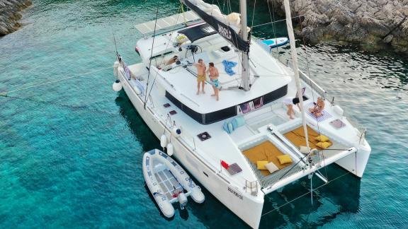 Guests enjoy the sun and clear water aboard the Marla Lagoon 450F catamaran near the Adriatic coast.