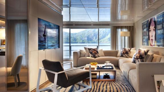 Stylish living room with stained glass windows on the Orient Star yacht