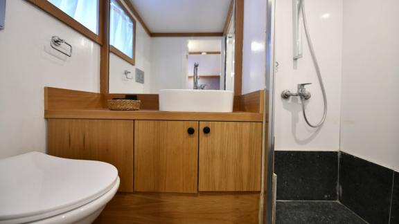 The stylish bathroom of Gulet Nayk 2 offers modern amenities and elegant design.