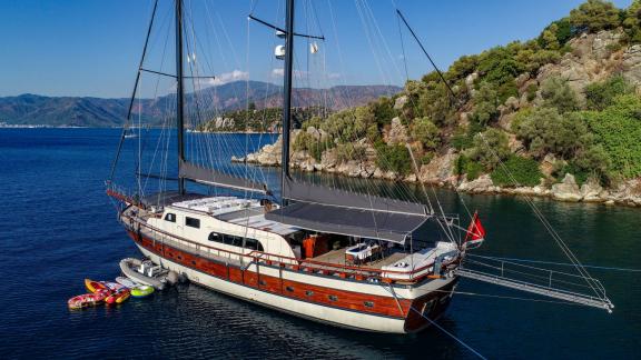 The 7-cabin gulet Ugur is anchored in the calm, blue waters of Marmaris, Turkey.