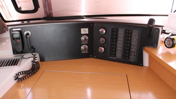 Control and switch panel with gauges and radio inside Catamaran Ayda1.