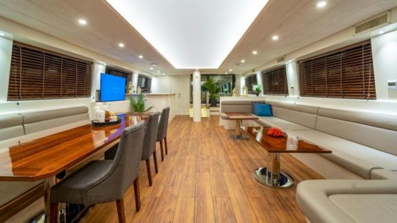 Spacious and stylish salon of the Queen of Makri with a cozy seating area and modern decor.