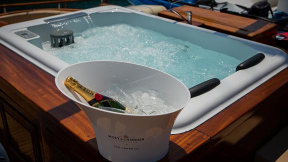 Jacuzzi on the gulet. Champagne can be seen chilled in a bowl of ice