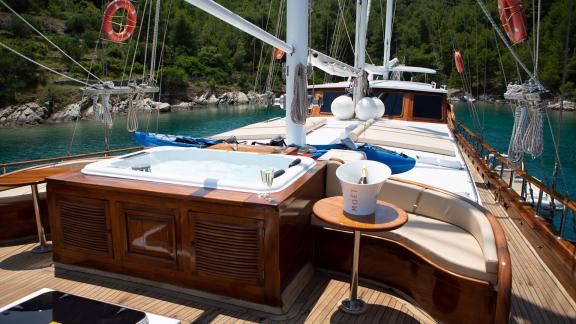 Luxury amenities on the upper deck. You can see the Jacuzzi and sun loungers