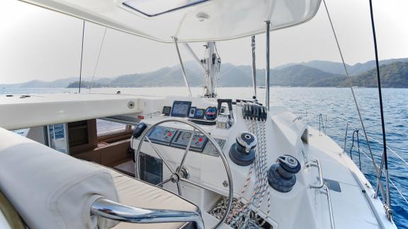 The helm station of catamaran Deniz3 offers panoramic sea views and modern navigation equipment.