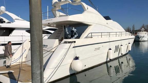 Abacus 70 Noi Quattro showcases its stern in Trogir Marina for daily and weekly yacht charter experiences.