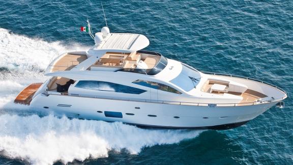 Near Trogir, Sea Side motor yacht cuts through open sea with flybridge, bow lounge and wake for weekly charter.