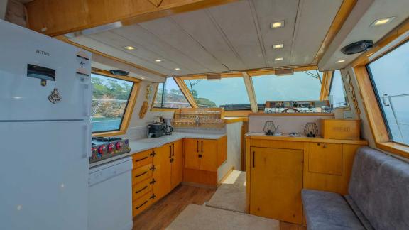 Kitchen and living area of motor yacht Ada Kuzey