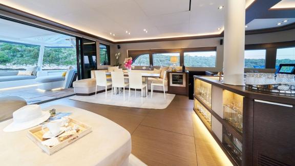 Luxurious salon with dining area and bar on Lagoon Seventy 7, perfect for relaxed evenings.