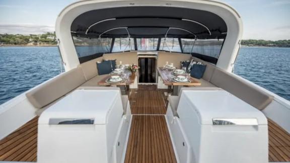 The cockpit of the Life Time sailing yacht offers a comfortable dining area with a sea view.