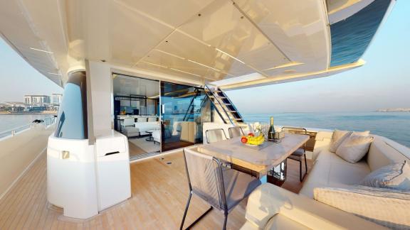 The outdoor space of the Ferretti 780 motor yacht adds luxury and comfort to your hourly yacht rental in Dubai.