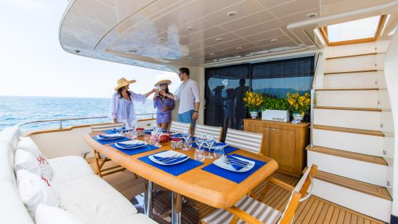 Enjoy an elegant meal with a Mediterranean view aboard the Riviera yacht.