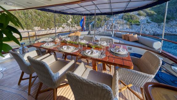 The luxurious dining area on the gulet Lotus in Croatia offers a stylish atmosphere for al fresco dining.