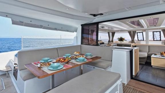 Helidoni charter catamaran offers a rich breakfast served with a sea view.