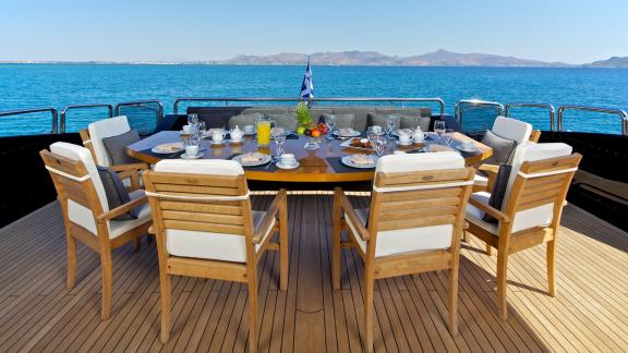 Enjoy an elegant lunch aboard the luxurious motor yacht O'Pati with stunning sea views.