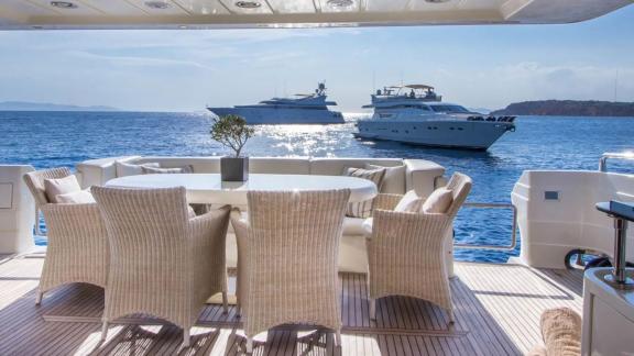 Spacious dining area on yacht Amoraki with an open sea view.