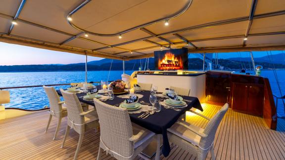 The aft deck of Mein Schatz features a spacious dining area and a cozy ambiance, perfect for a luxury gulet charter in T