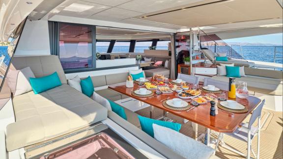 A beautifully set table on the spacious deck offers a peaceful breakfast with Mediterranean breezes.