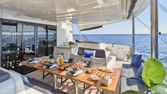 The catamaran Andare Avanti offers a rich breakfast with sea views near Athens.