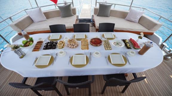 Enjoy a luxurious dinner on Gulet Lavinia with a spectacular sea view.