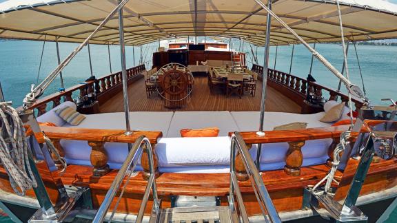 The inviting main deck of the Gulet Holiday X in Fethiye with 10 cabins, equipped with cosy seating and dining areas.