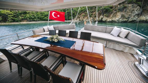 Elegant dining area on the deck with coastal views.