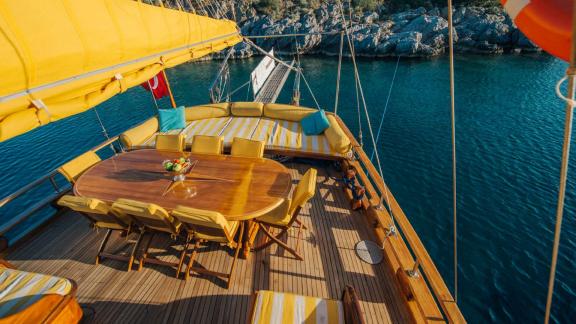 Elegant dining area on the deck of Gulet Nikola. Perfect place for meals with a sea view.