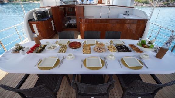 Enjoy a delicious dinner in the elegant dining area of Gulet Lavinia on the sea.