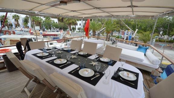 Elegantly set table on Gulet Tufan 5, ideal for outdoor dining.