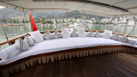 Comfortable lounge on the deck of the gulet Holiday X in Fethiye with 10 cabins, ideal for relaxing and enjoying the vie