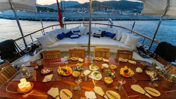 Dining and living area on the aft deck of luxury gulet Babylon picture 2