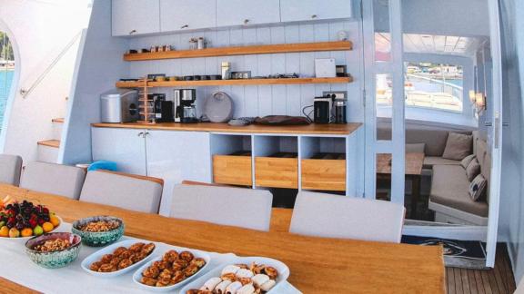 Breakfast table and kitchen area on a gulet.