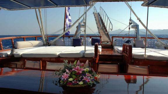 The sun deck of the Gulet Matina in Greece, equipped with comfortable loungers and a view of the open sea