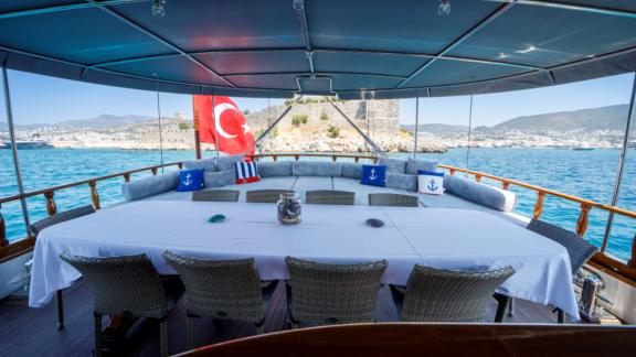 Enjoy an elegant dinner on Gulet Ya Selam with views of Bodrum's coastline.