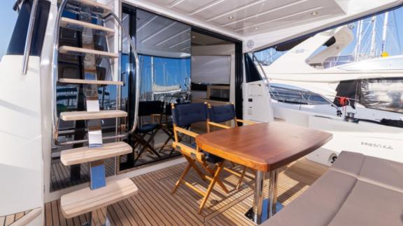 Aft deck of motor yacht Serendipity I with dining area.