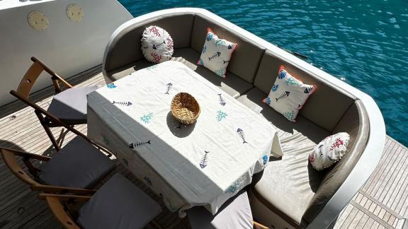 Aft deck seating area of motor yacht Labarna in Göcek, offering relaxing moments with a sea view.