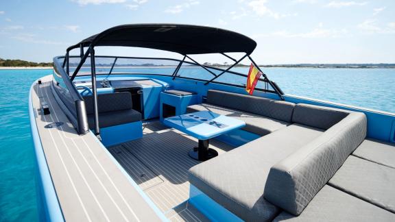 The aft section of Blue Steel motor yacht offers a shaded seating area.