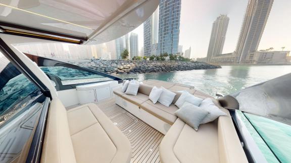 Pershing 5X White provides comfortable seating areas for luxury yacht rentals in Dubai.