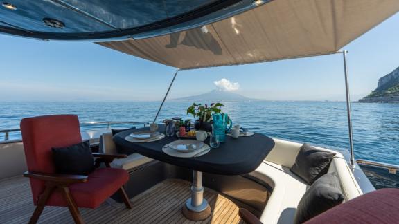 Naples motoryacht charter for a luxurious dining experience with a sea view on Lady B.