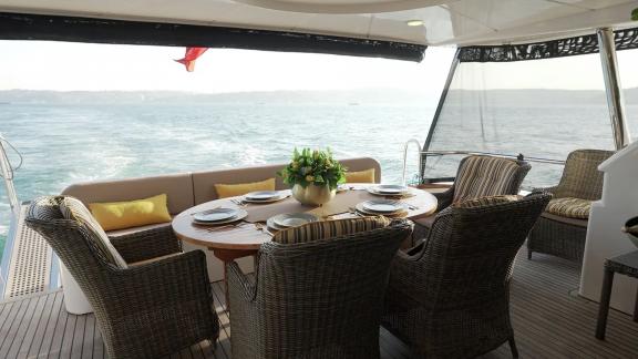 Göcek motor yacht Ayem features an elegant aft dining area perfect for sea-view meals.